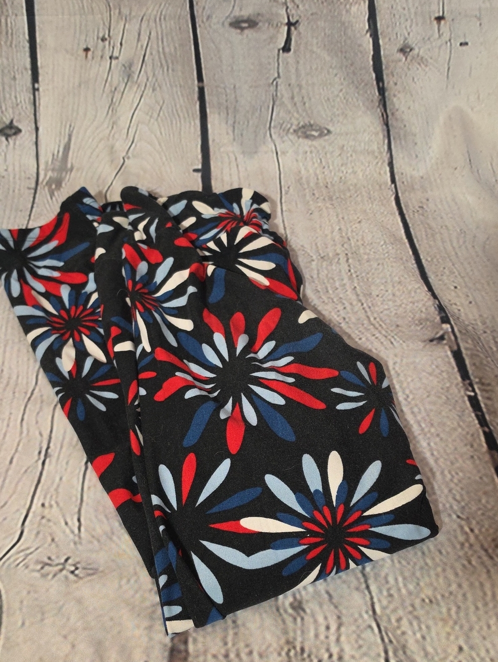 LuLaRoe Black Leggings with Red, Blue & White Floral Starburst